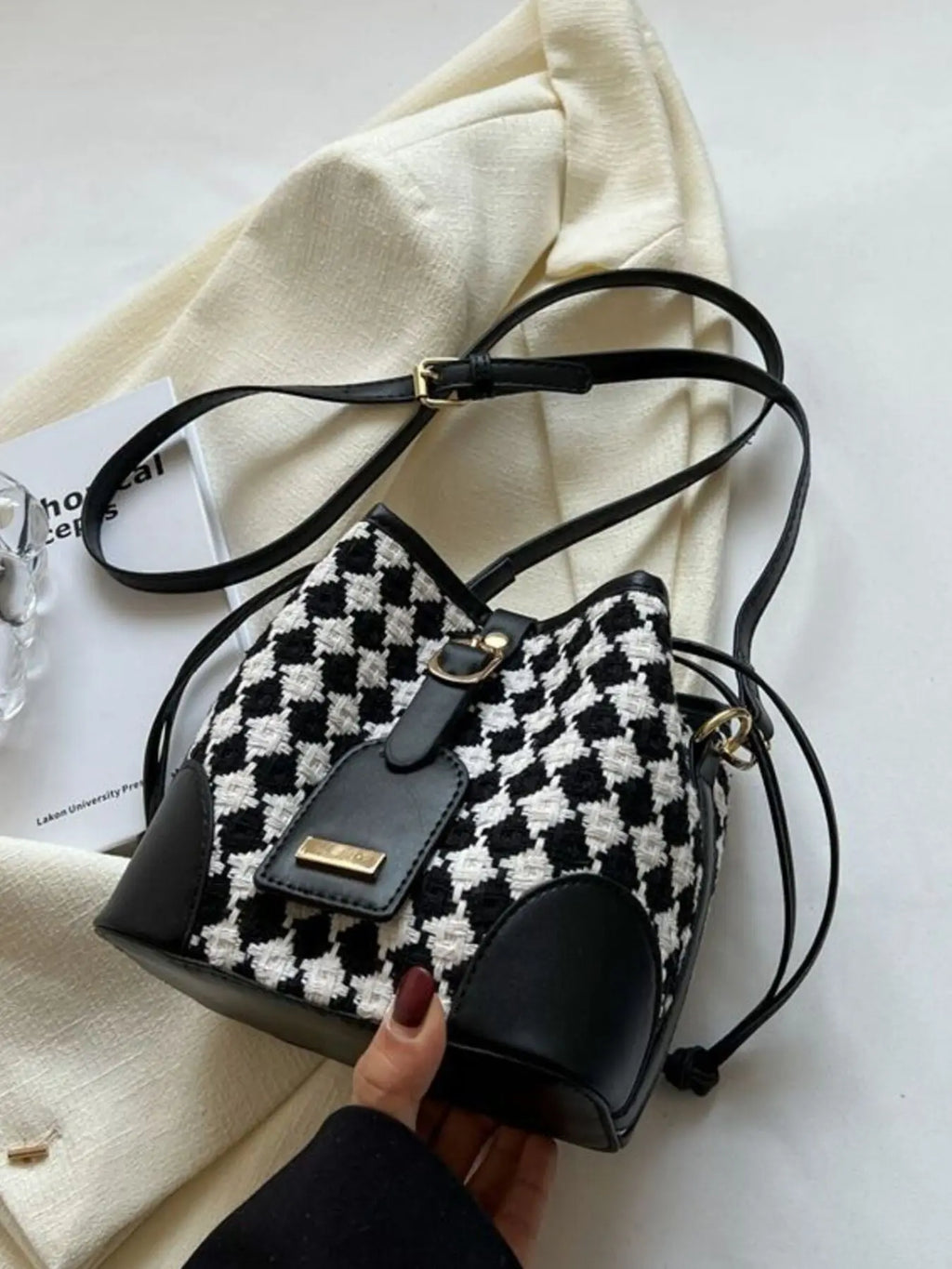 Checkerboard woven bucket crossbody bag styled on model Vicsxox.com