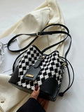 Checkerboard woven bucket crossbody bag styled on model Vicsxox.com