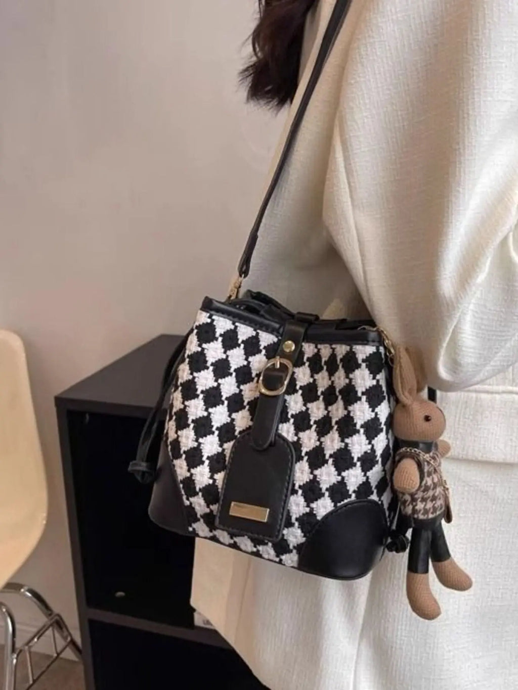 Checkerboard woven bucket crossbody bag styled on model Vicsxox.com