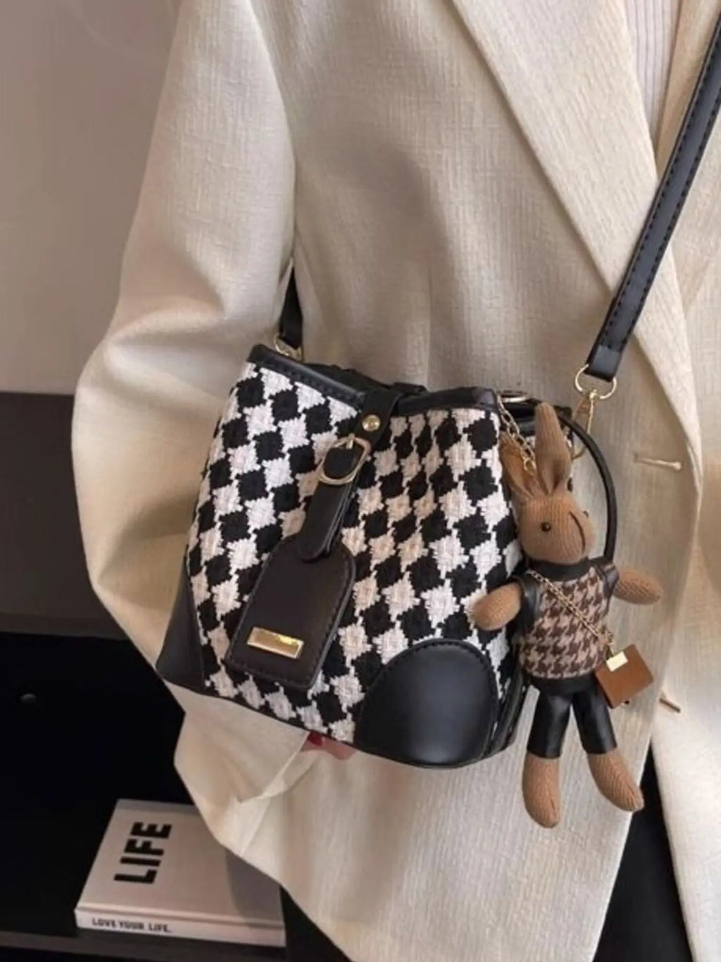 Checkerboard woven bucket crossbody bag styled on model Vicsxox.com