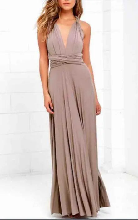 Woman wearing a long, flowing dress against a white background