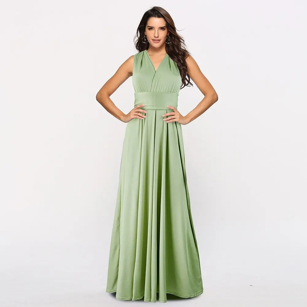 Woman wearing a green halter neck dress on a white background