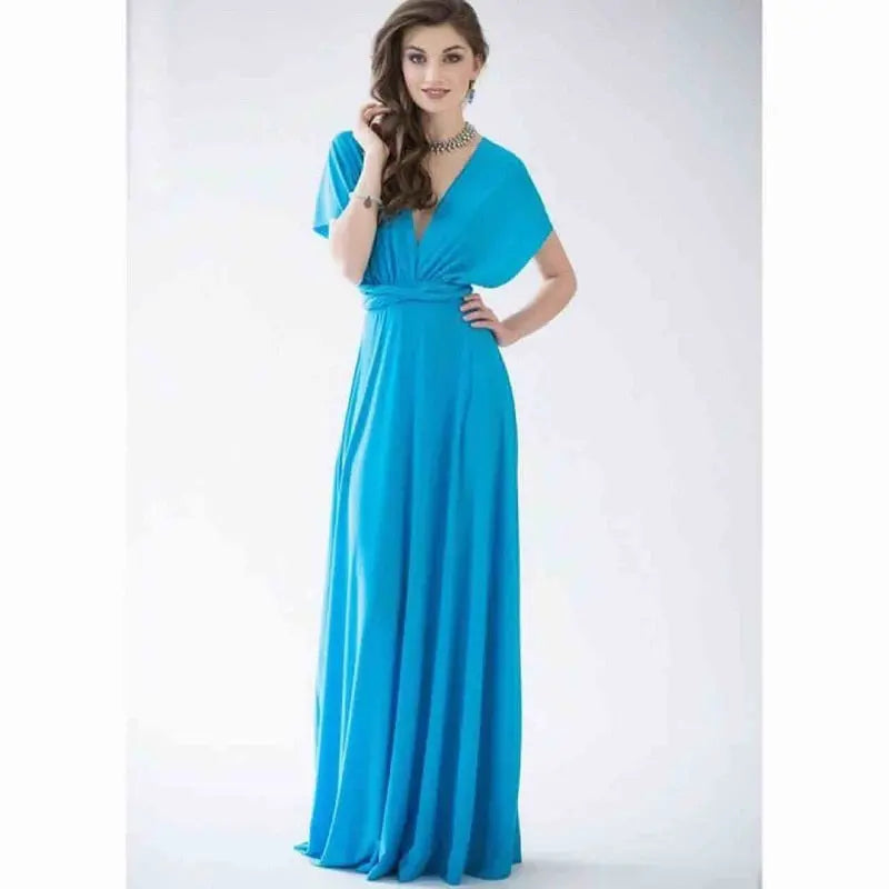 Woman wearing a turquoise dress on a white background