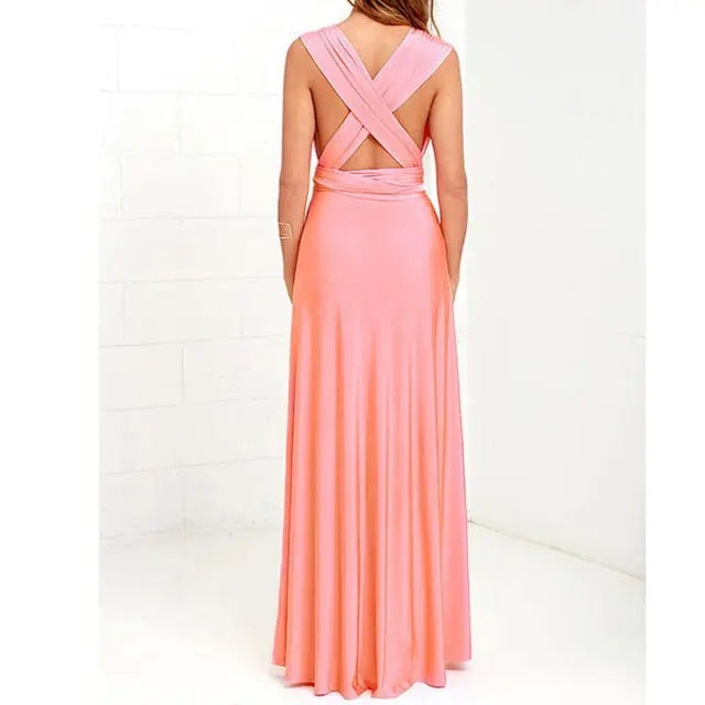 Peach-colored evening gown with open back on a white background