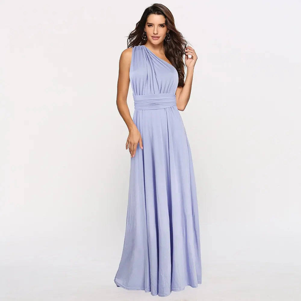 Woman wearing a light blue one-shoulder dress on a white background