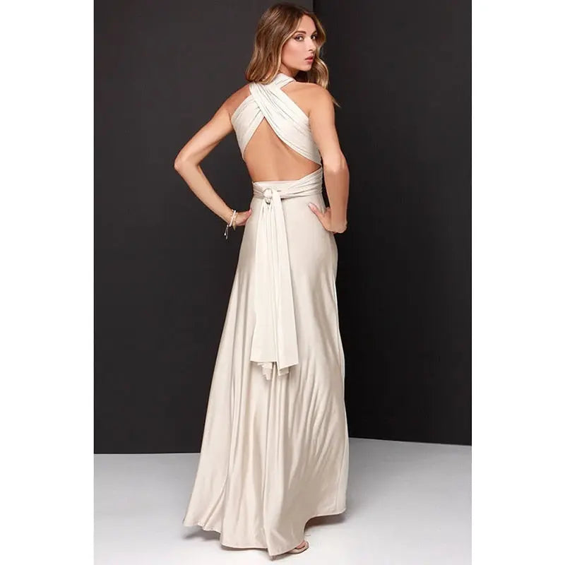 Woman wearing a white evening gown with a black background