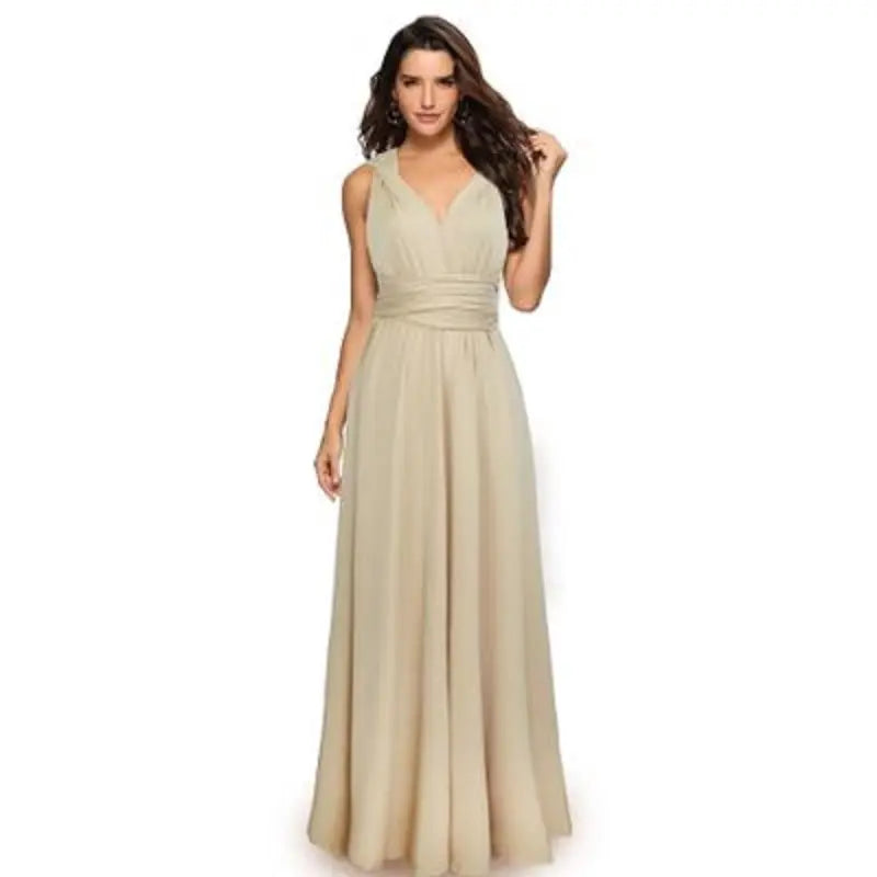 Woman wearing a beige evening gown on a white background