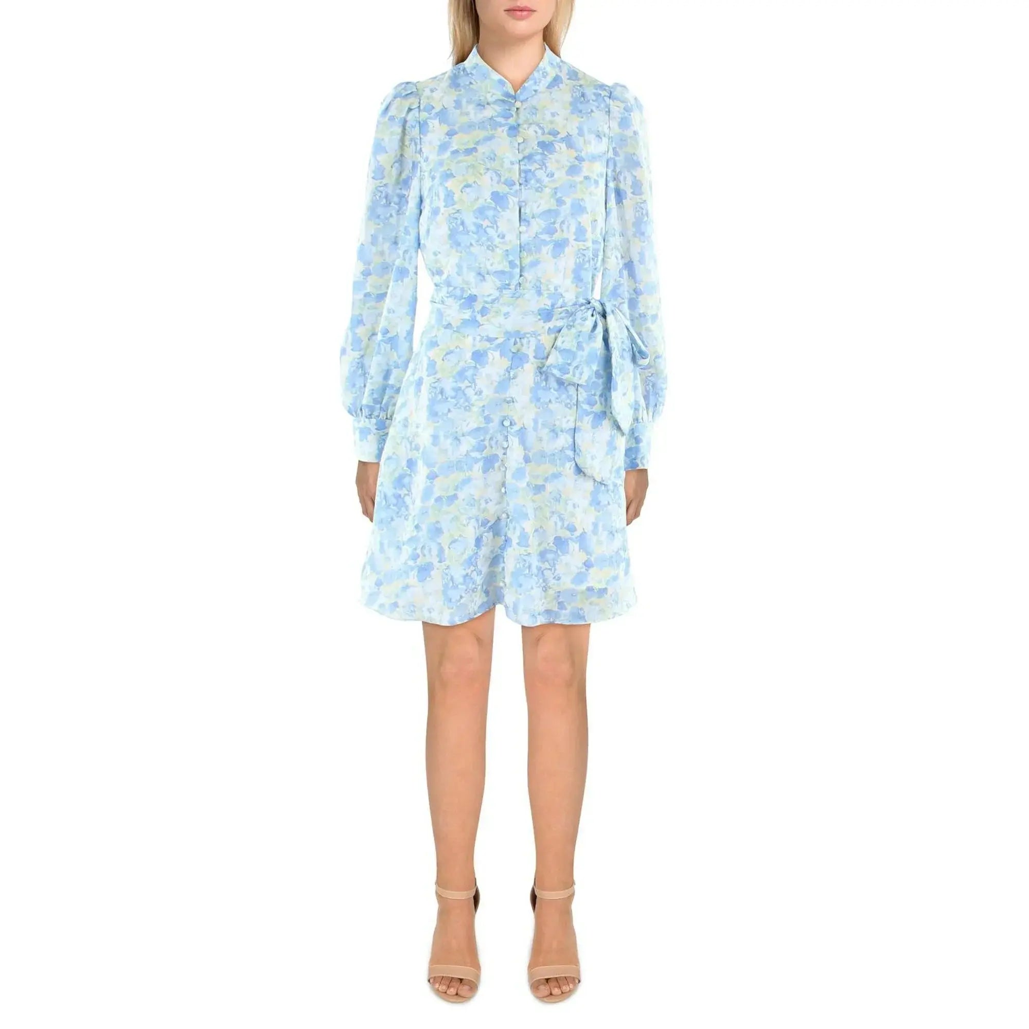 Woman wearing a light blue floral dress on a white background