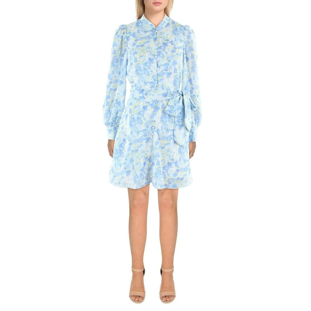 Woman wearing a light blue floral dress on a white background