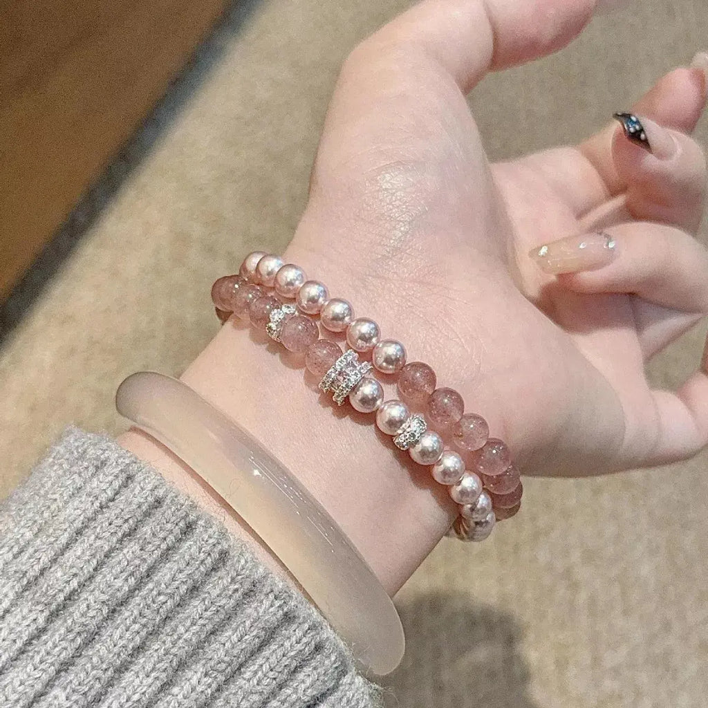 Close-up of crystal and zircon detail on pearl bracelet set