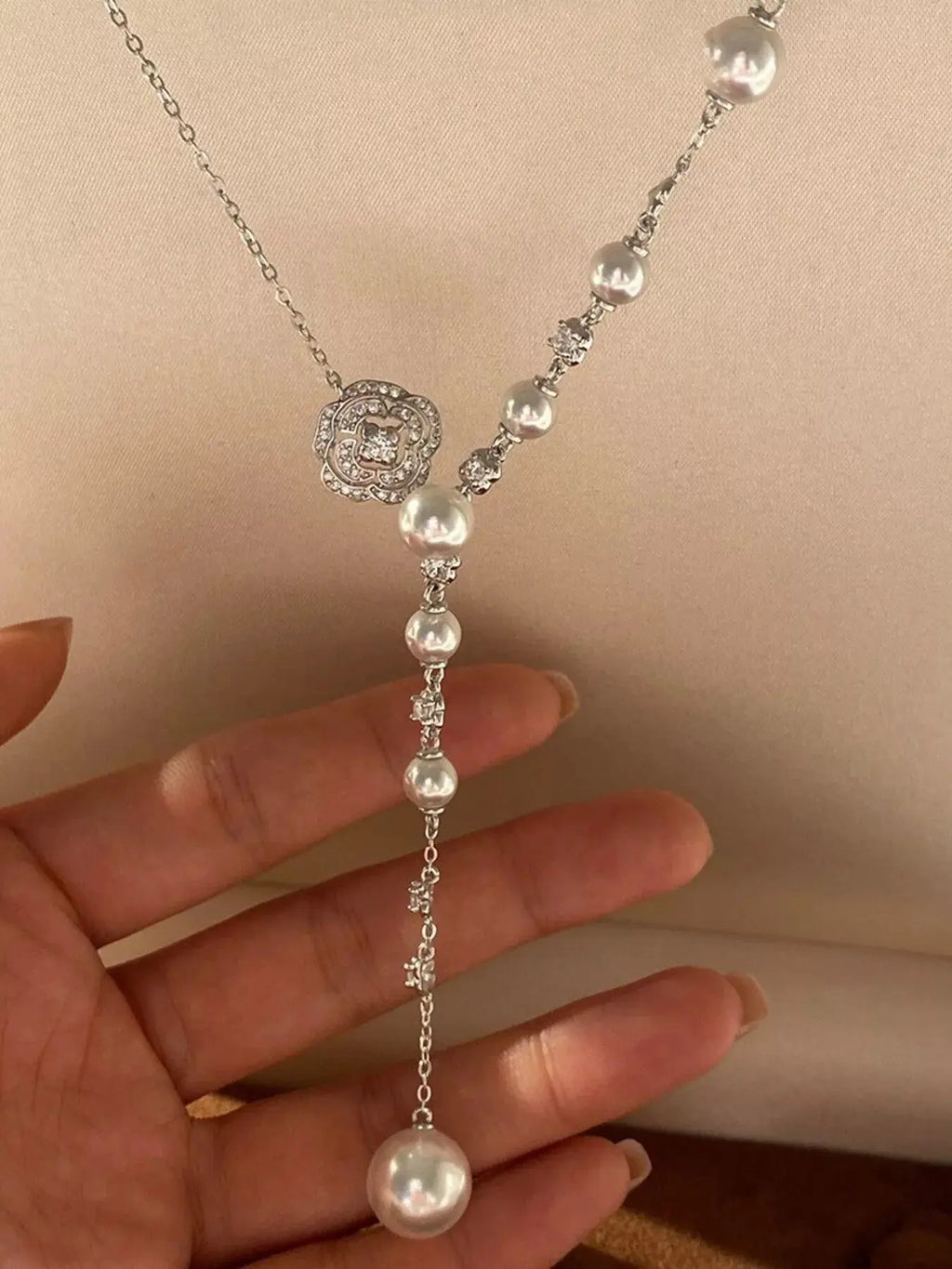 Close-up of pearl flower pendant on Y-necklace