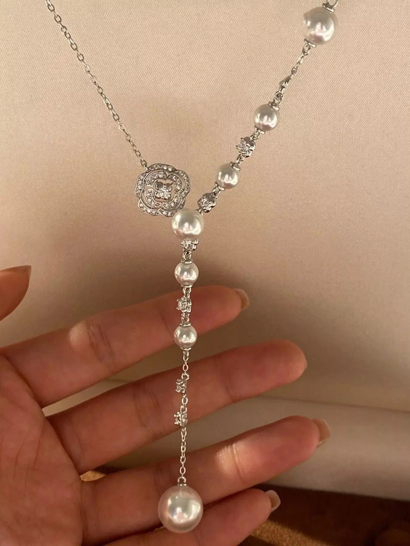 Close-up of pearl flower pendant on Y-necklace