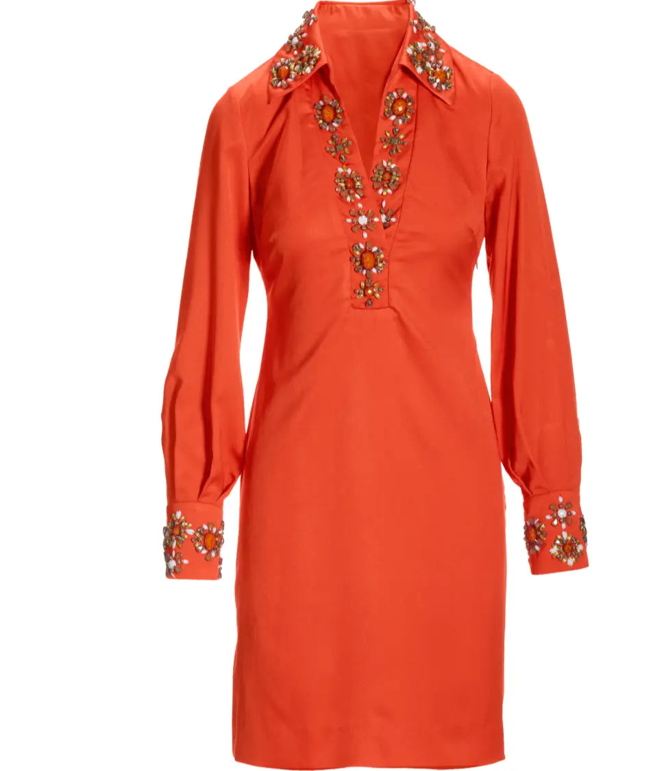 Orange dress with intricate beadwork on a white background