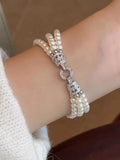 Three layers pearl bracelet from Vicsxox on display
