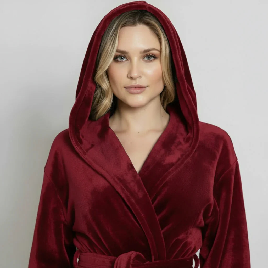Woman wearing a red hooded robe against a plain background. Vicsxox.com