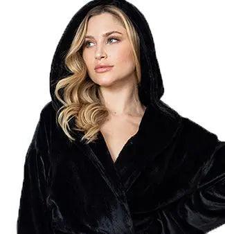 Woman wearing a black hooded robe against a white background. Vicsxox.com
