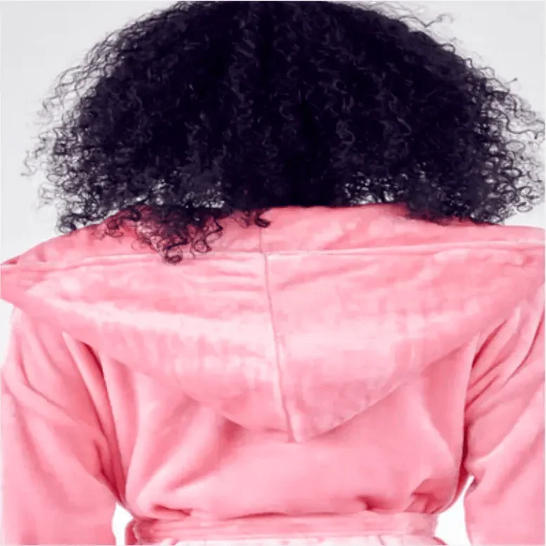 Person wearing a pink jacket with curly hair visible. Vicsxox.com