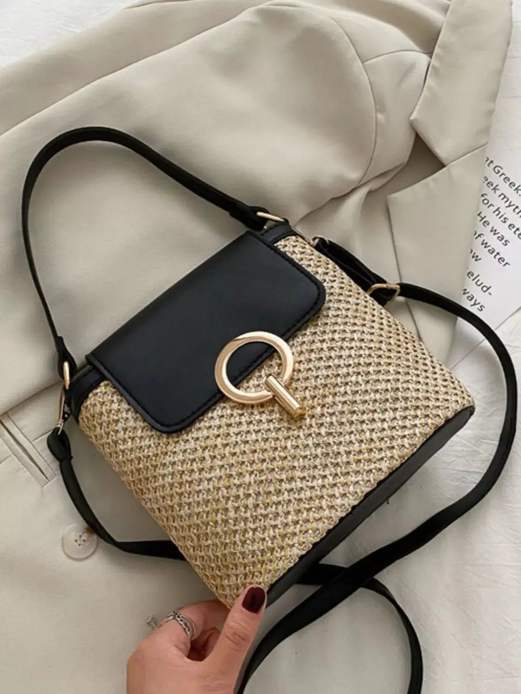 Woven straw crossbody bag with leather flap, front view Vicsxox.com 