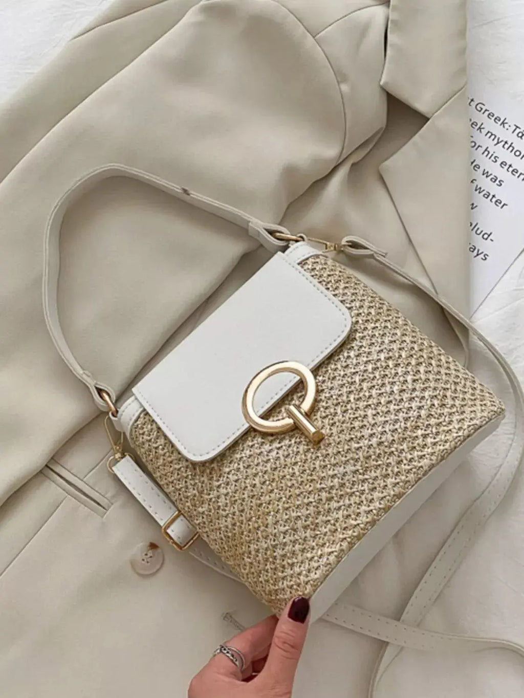 Woven straw crossbody bag with leather flap, front view Vicsxox.com 