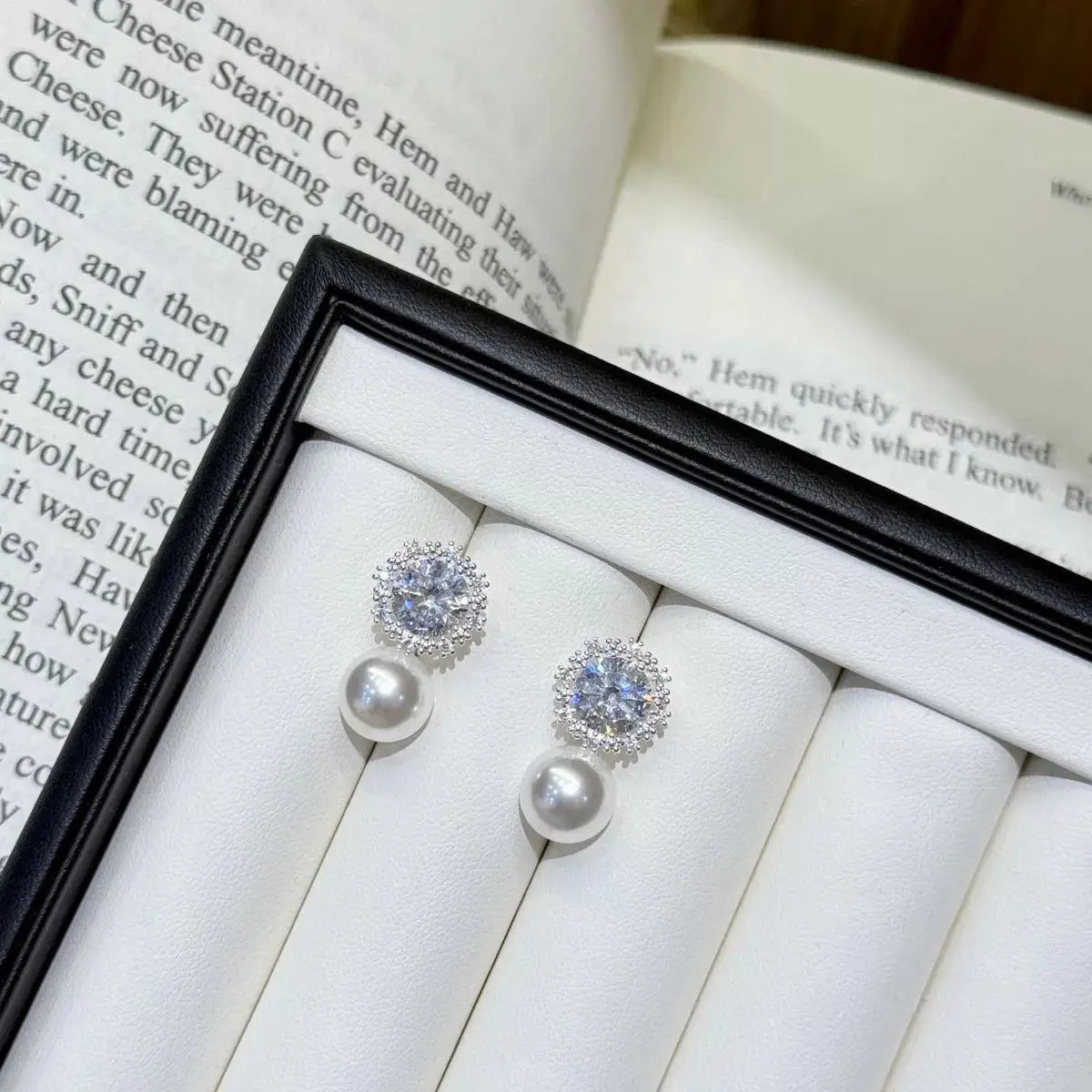 Zircon pearl drop earrings from Vicsxox on display