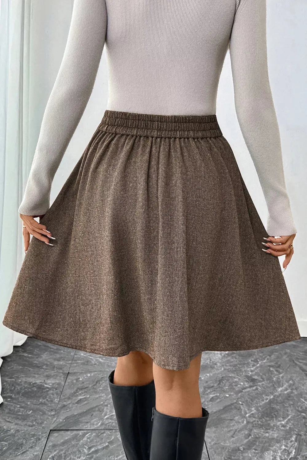 A-line textured skirt styled on model