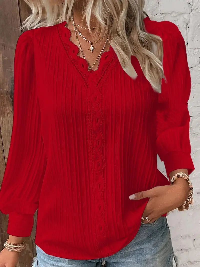 Red blouse worn by a person with a white background