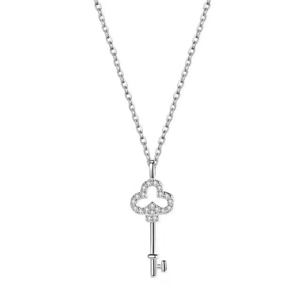 Woman wearing key pendant necklace