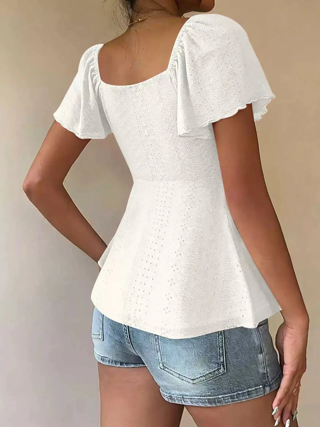 Side view of sweetheart neck flutter sleeve top