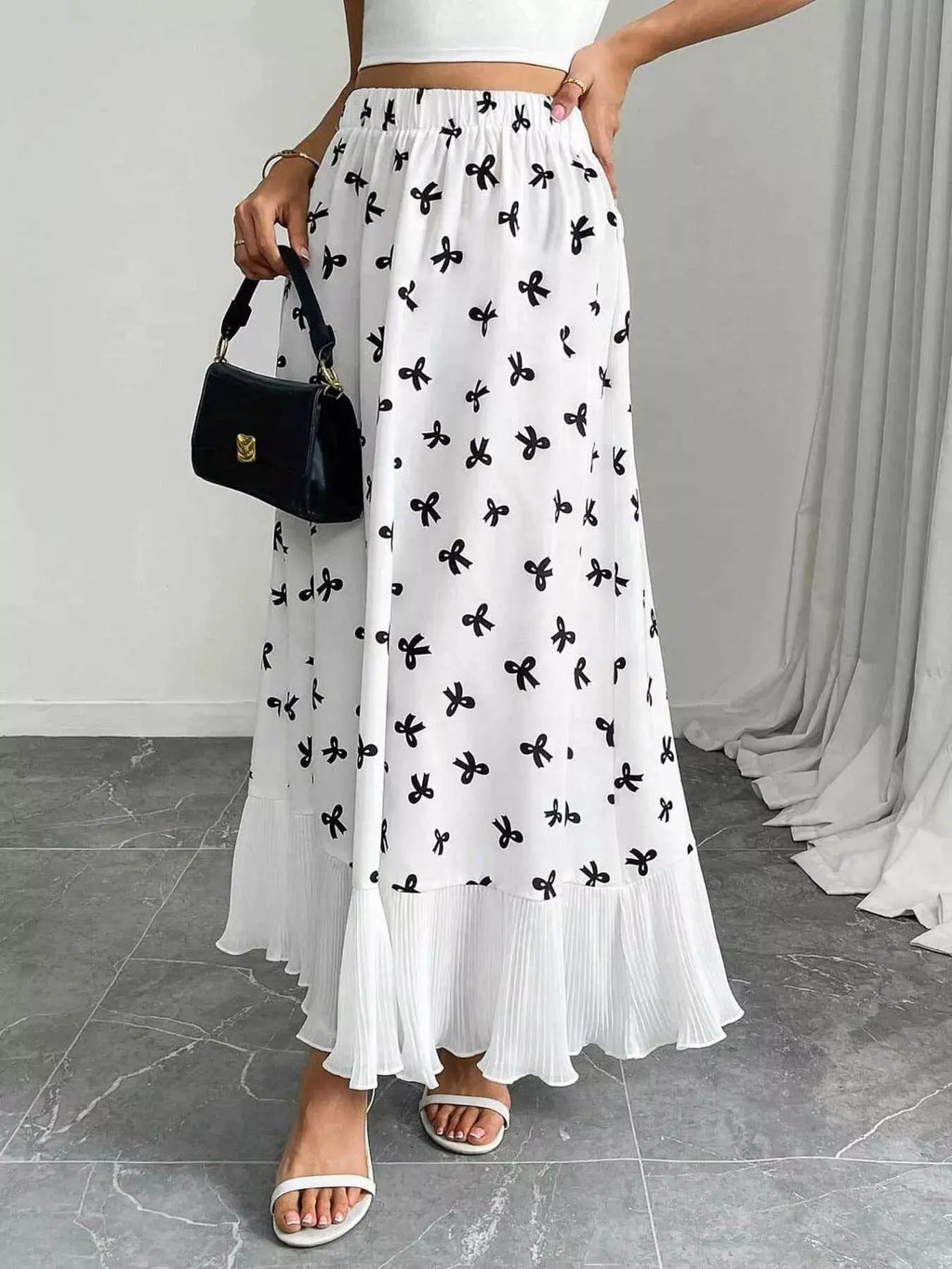 Bow print ruffle maxi skirt styled on model