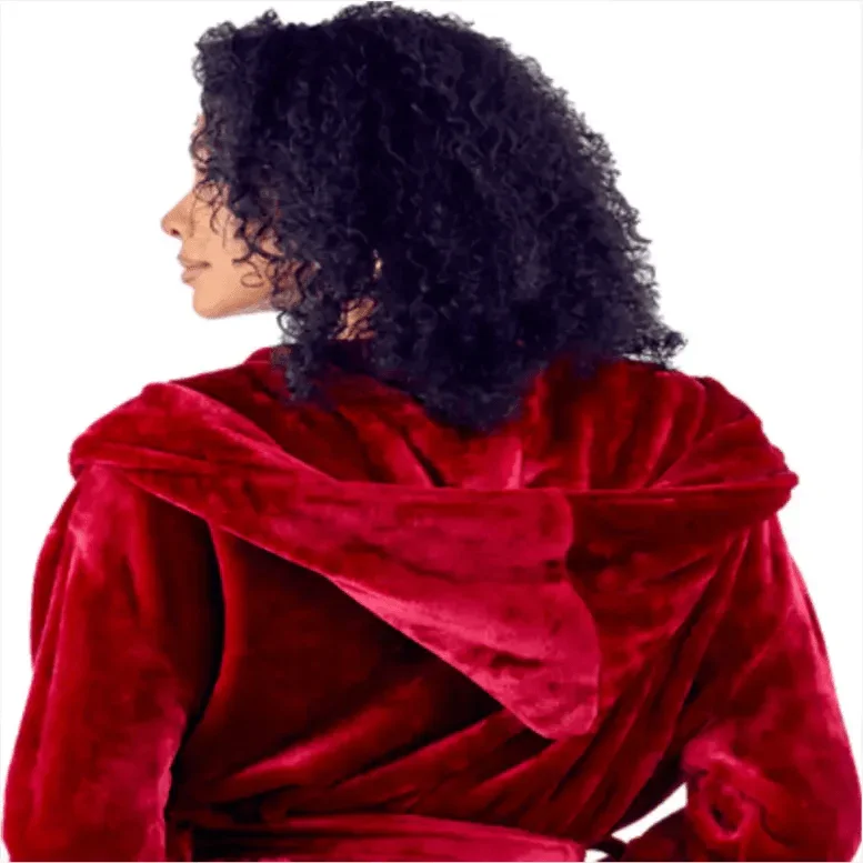 Person wearing a red velvet garment with a white background. Vicsxox.com