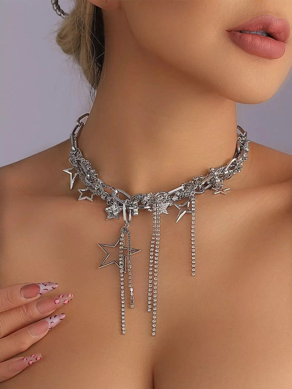 Chunky chain star tassel necklace styled on model