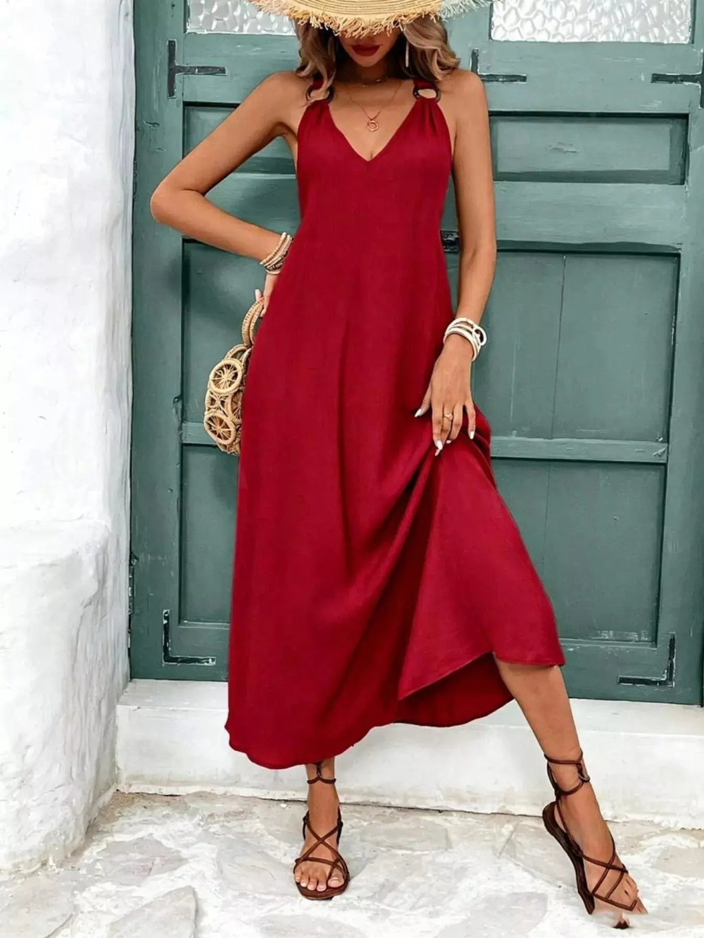 Close-up of v-neckline on sleeveless midi dress