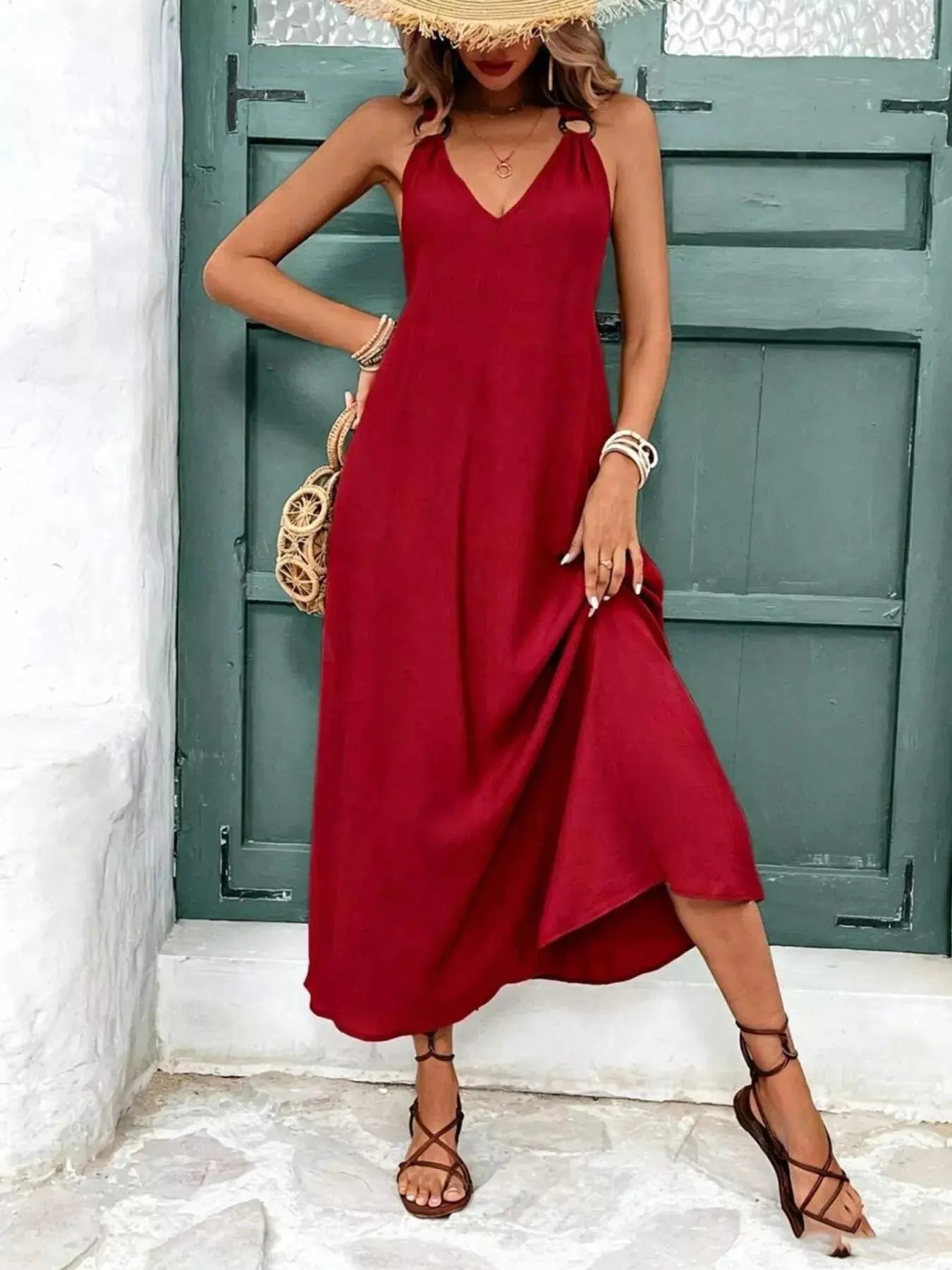 Close-up of v-neckline on sleeveless midi dress