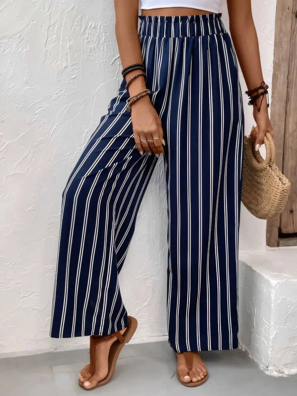 Striped wide leg pants styled on model