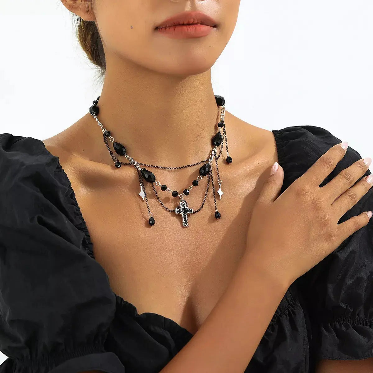 Close-up of gothic cross pendant detail