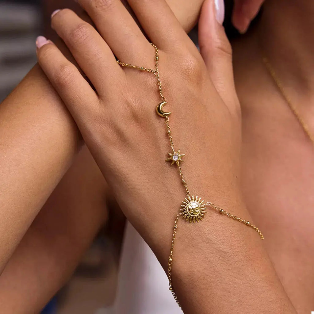 Woman wearing gold chain sun bracelet