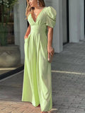 Woman wearing a puff sleeve wide leg jumpsuit from Vicsxox