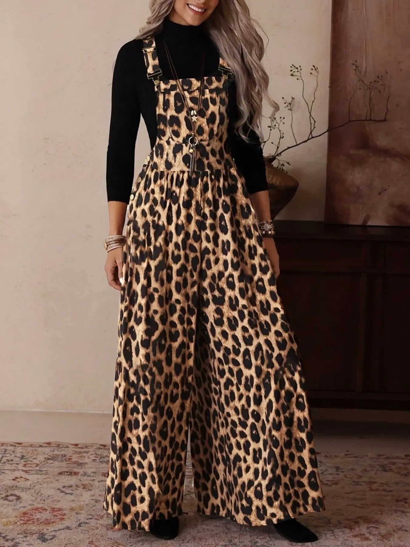 Close-up of leopard print pattern on wide leg overalls