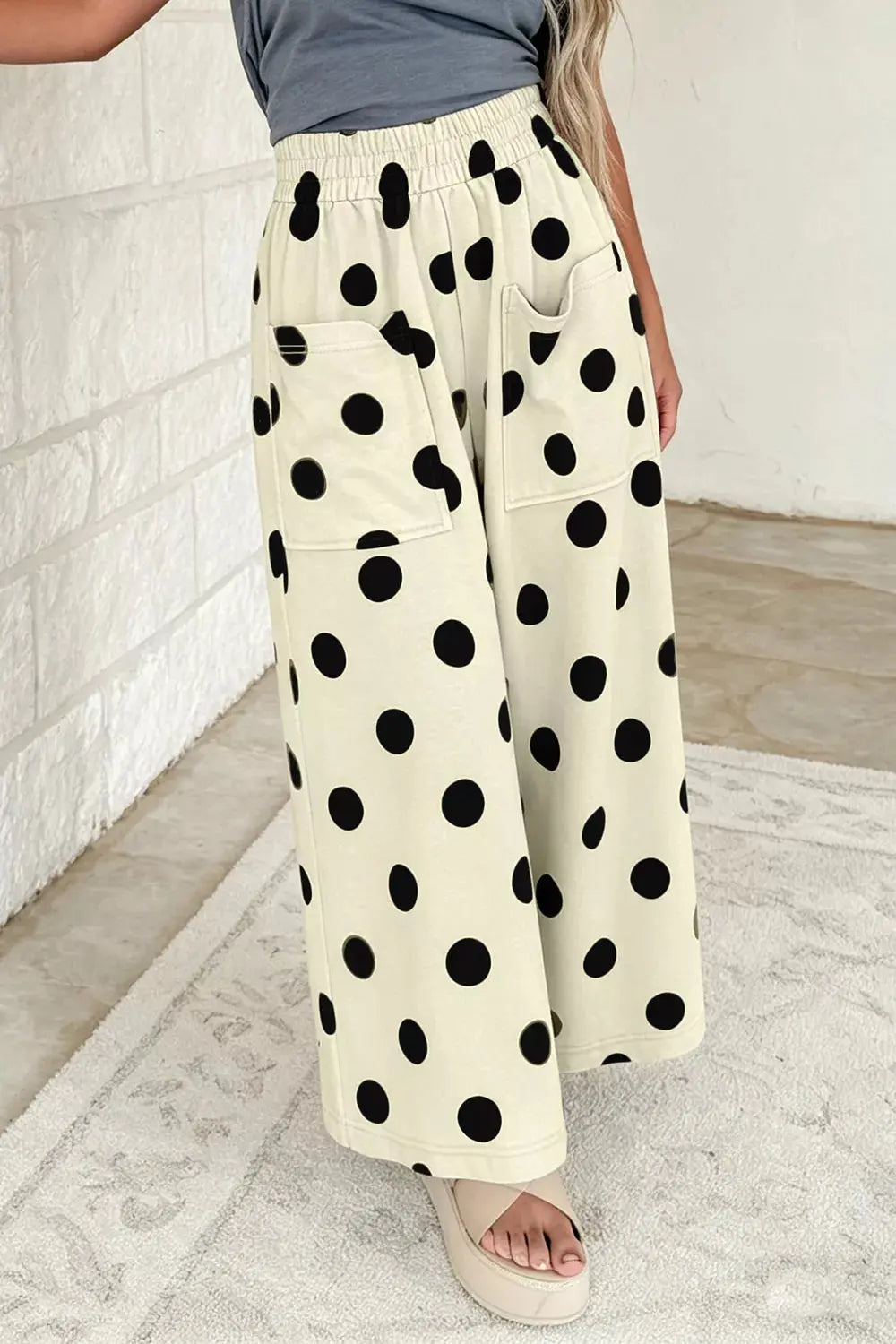 Polka dot wide leg pants styled on model