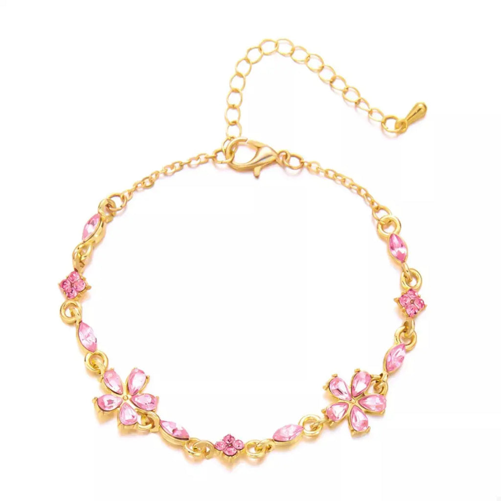 Woman wearing gold rhinestone flower bracelet