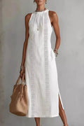 Woman wearing a sleeveless side slit dress with pockets from Vicsxox