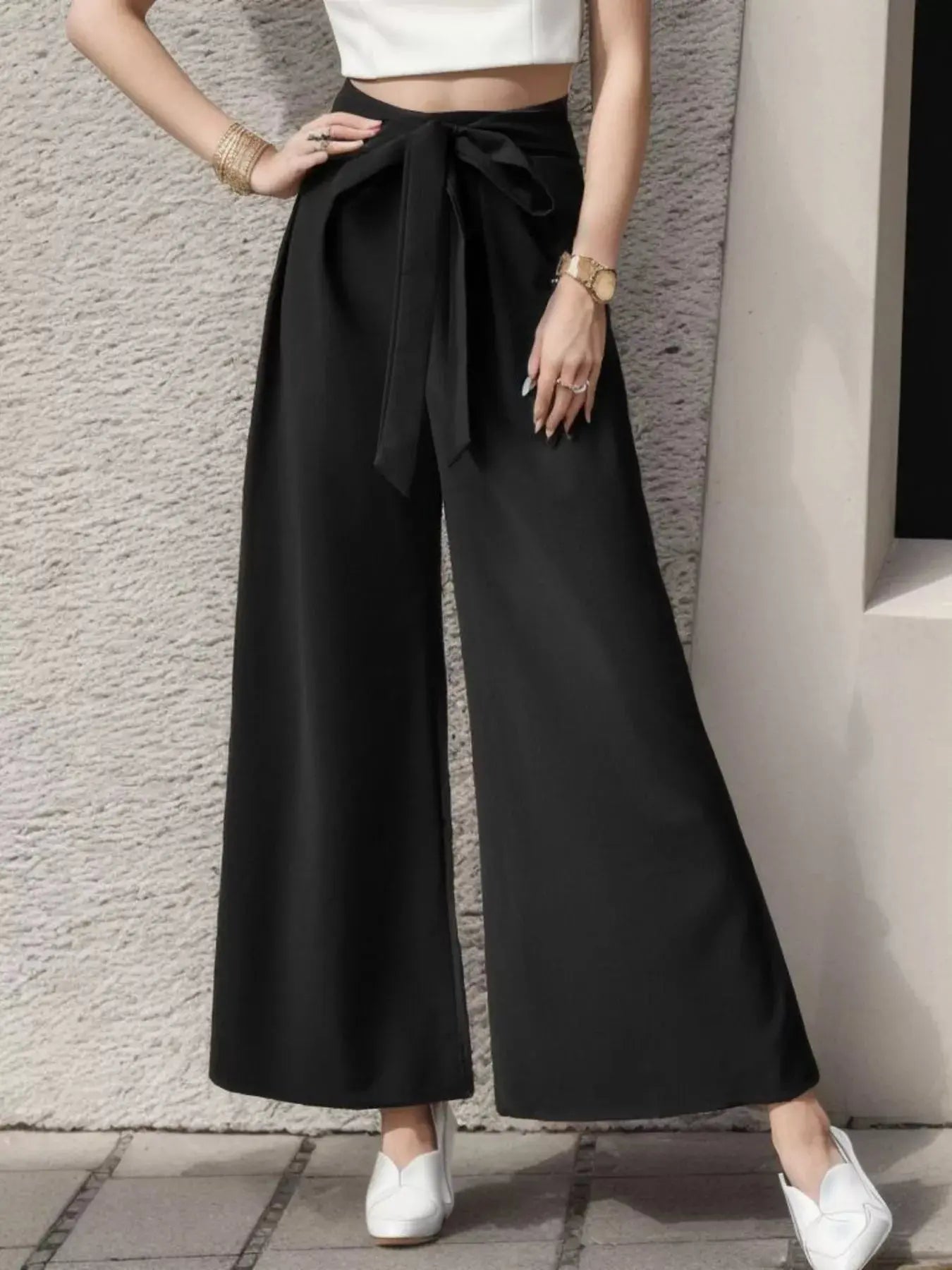High-waisted wide-leg pants detail
