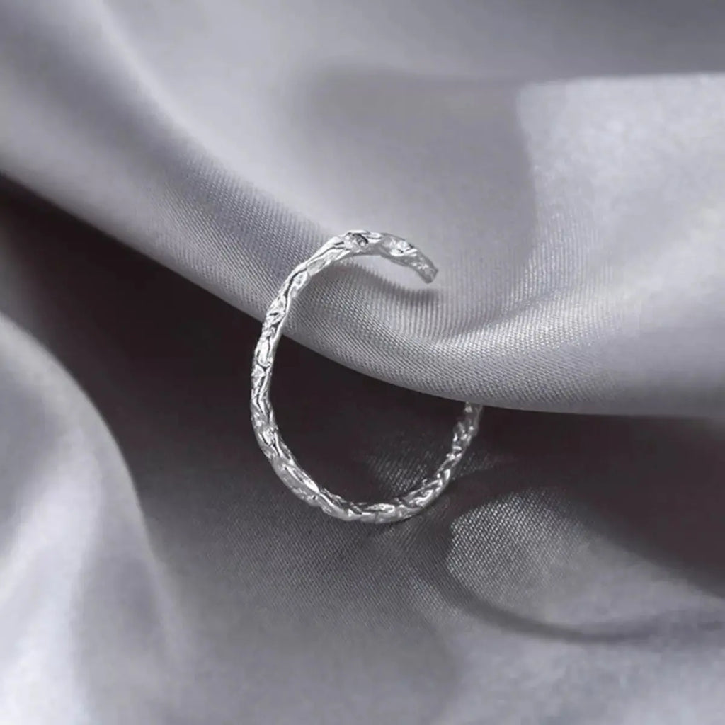Close-up of texture detail on silver open ring