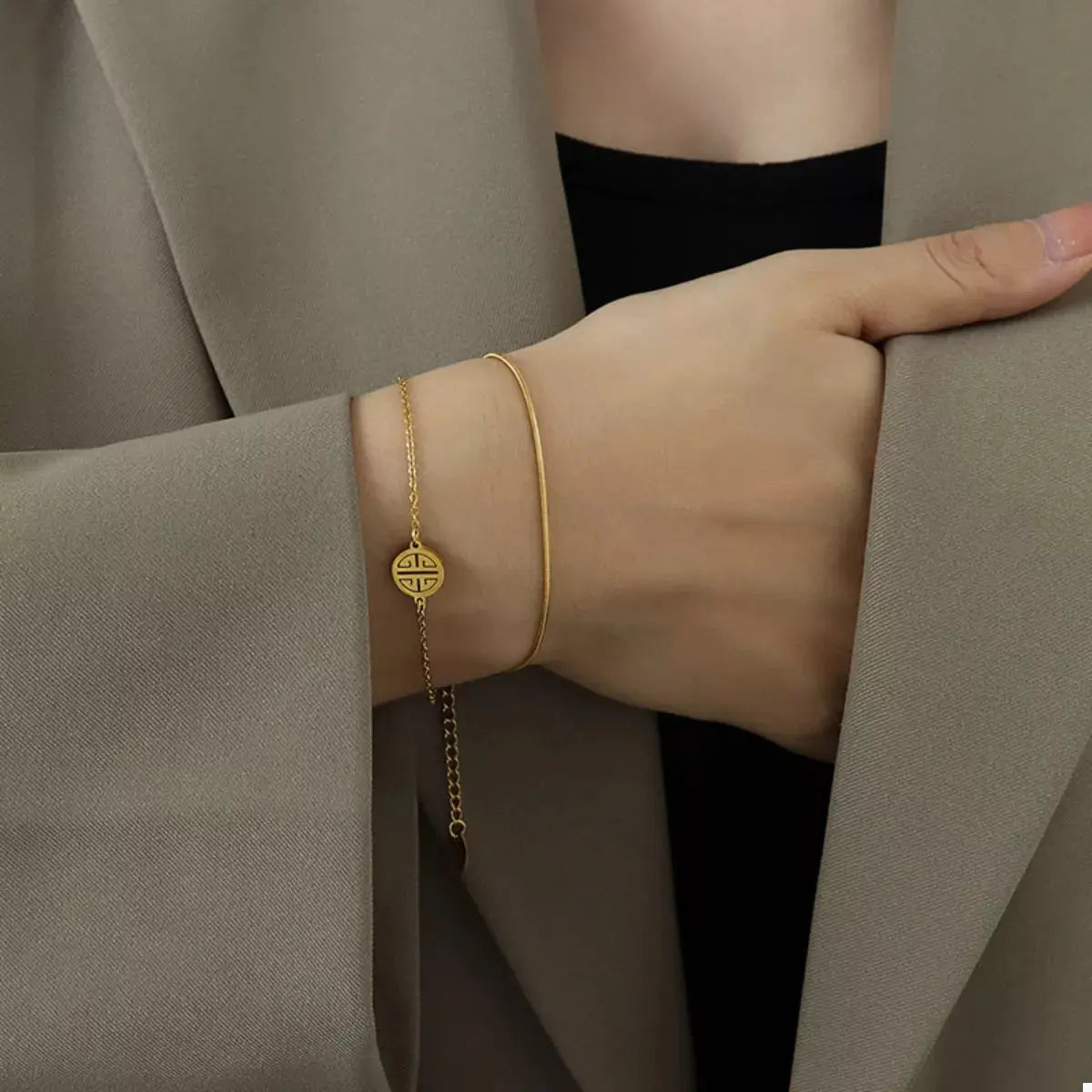 Woman wearing gold double layered bracelet