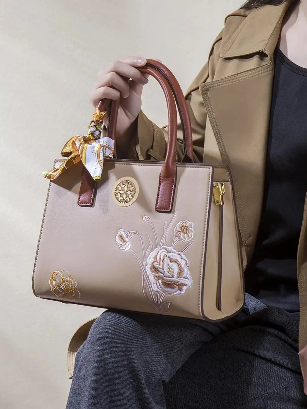 Floral embroidered top handle handbag in vegan leather, front view