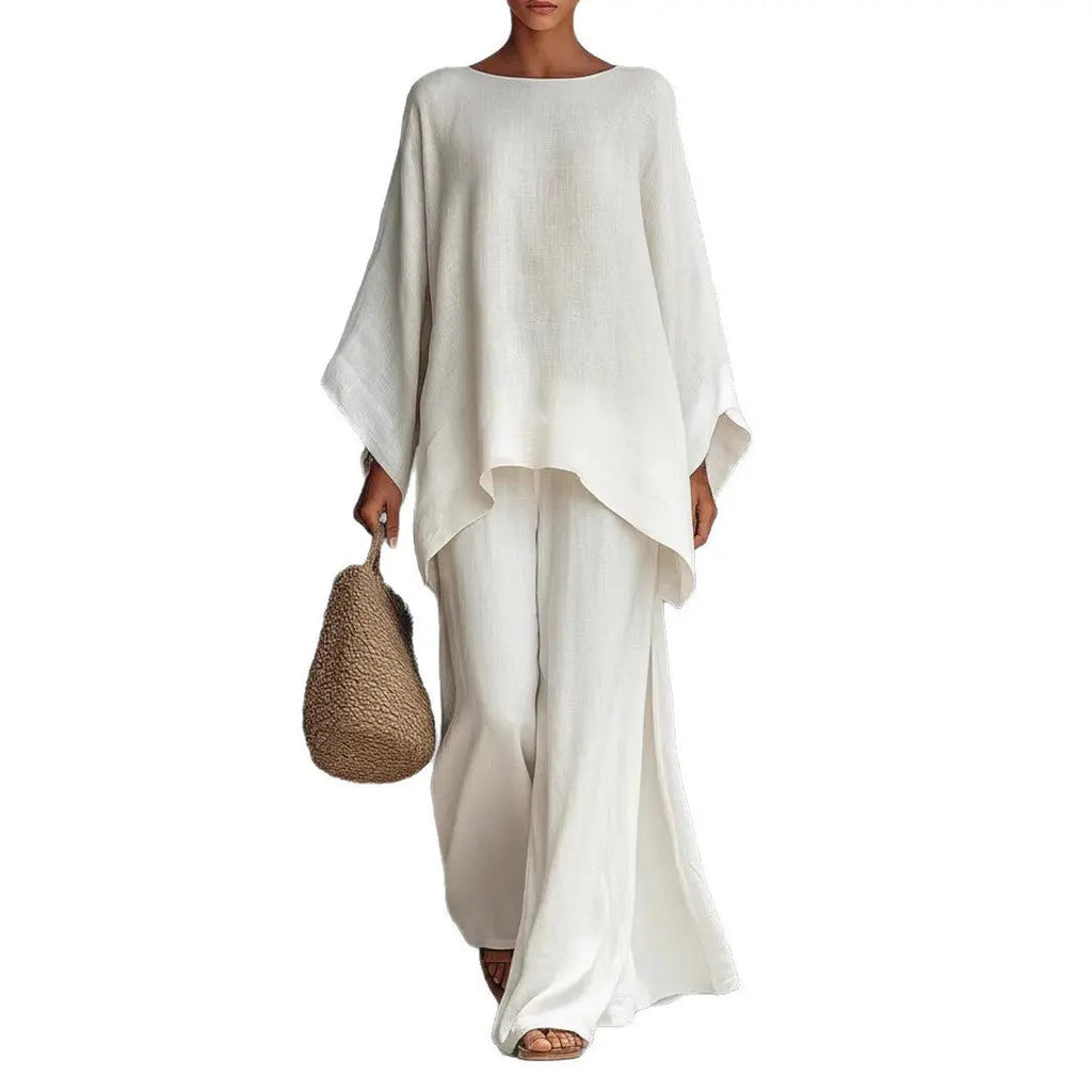 Person wearing a white outfit holding a woven bag on a white background