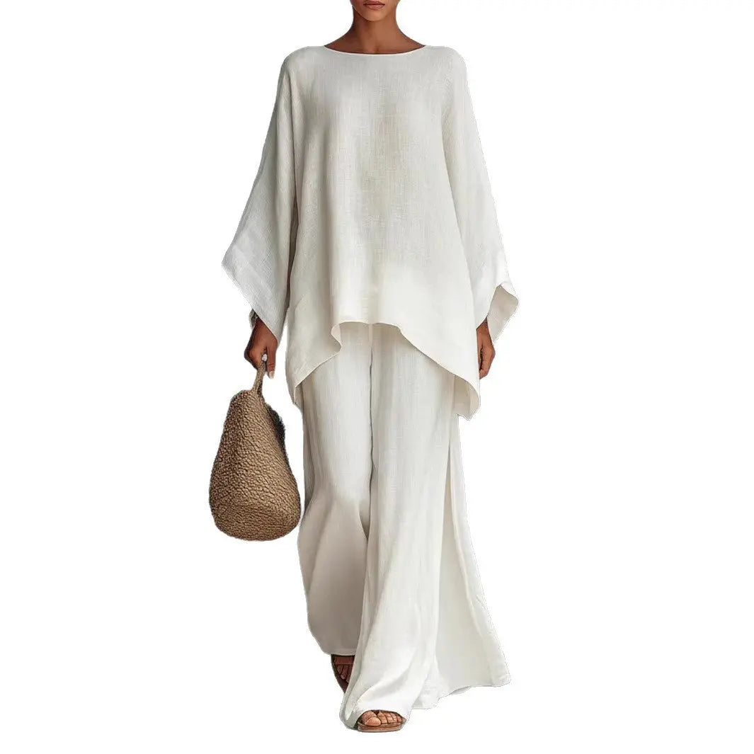 Person wearing a white outfit holding a woven bag on a white background