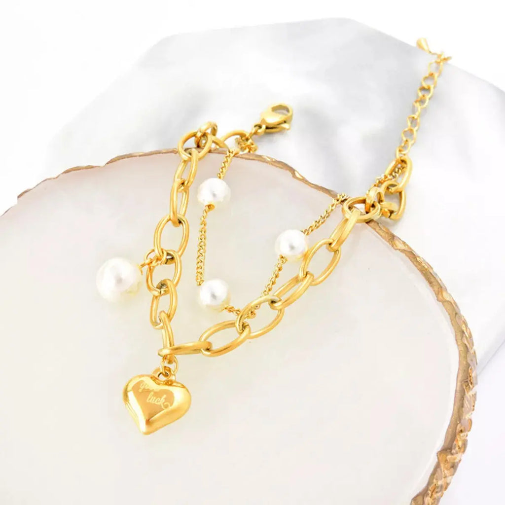 18K gold-plated pearl heart charm bracelet from Vicsxox