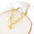 18K gold-plated pearl heart charm bracelet from Vicsxox