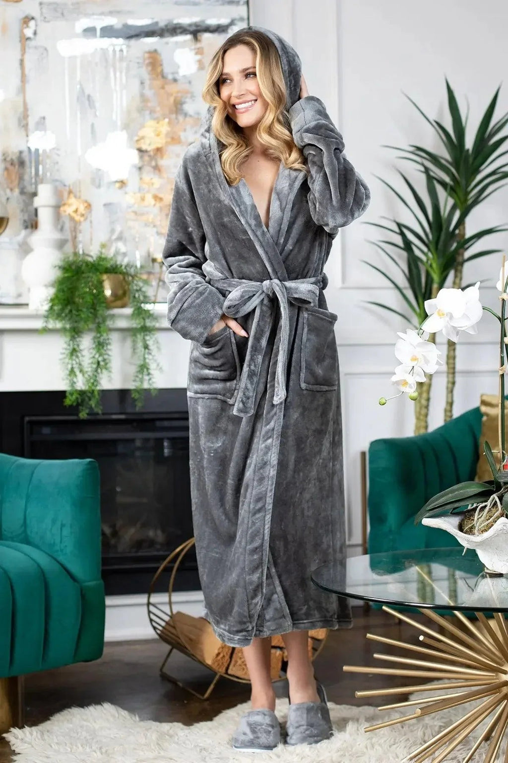 Woman wearing a gray robe in a stylish living room. Vicsxox.com